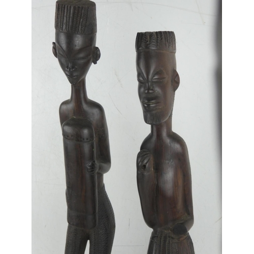 373 - A pair of large carved wooden African figures.