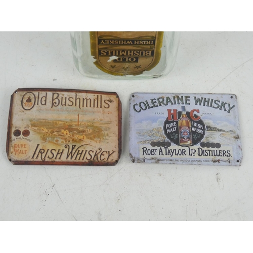 376 - A vintage Old Bushmills Whiskey bottle & 2 tin signs.