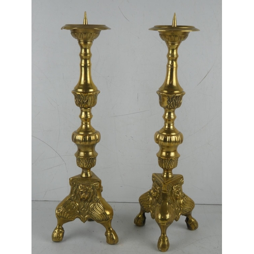 390 - A stunning pair of large antique brass candlesticks.