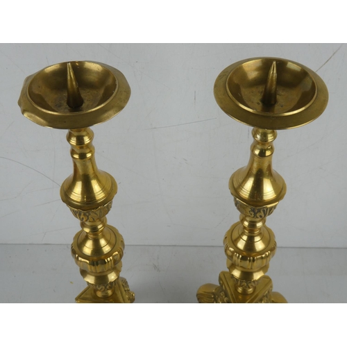 390 - A stunning pair of large antique brass candlesticks.