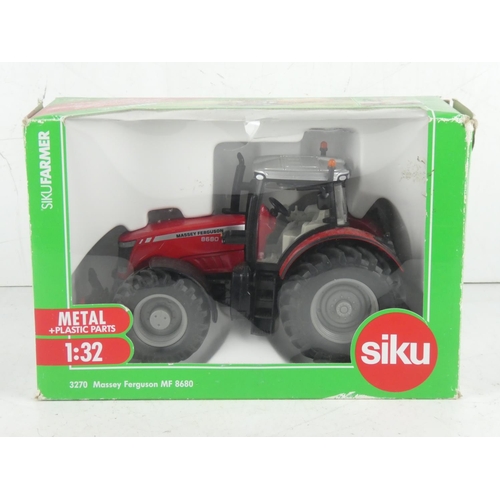 397 - A boxed Siku 3270 Massey Ferguson MF 8680 model Tractor.