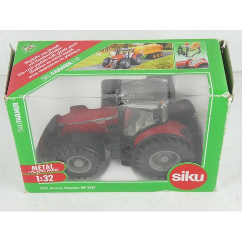 397 - A boxed Siku 3270 Massey Ferguson MF 8680 model Tractor.