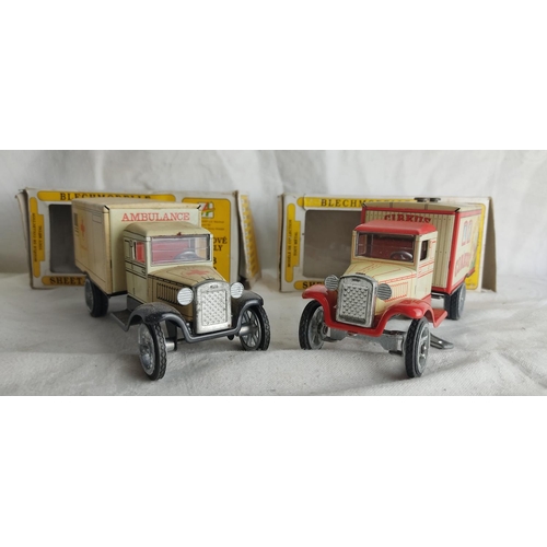 404 - A pair of vintage tin plate 'Blechmodelle' model trucks in original boxes.