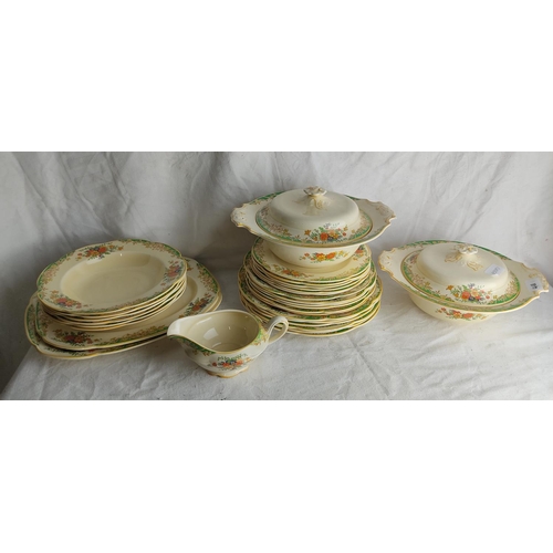 411 - A decorative antique dinner service.