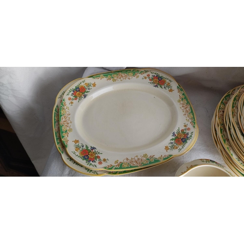 411 - A decorative antique dinner service.