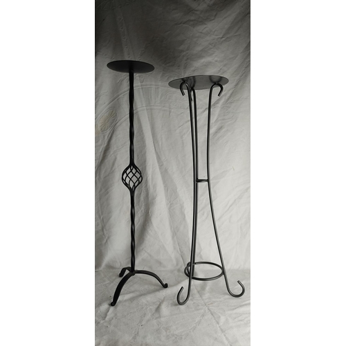 416 - 2 wrought iron candlesticks.