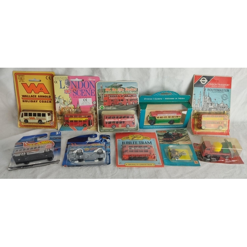 439 - A collection of 10 model buses etc in original packaging.