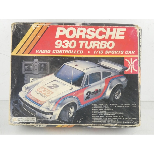 463 - A vintage boxed Radcon Porsche 930 Turbo radio controlled 1/15 sports car with instructions.