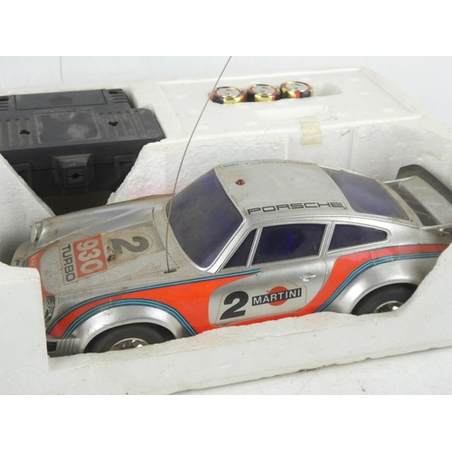 463 - A vintage boxed Radcon Porsche 930 Turbo radio controlled 1/15 sports car with instructions.