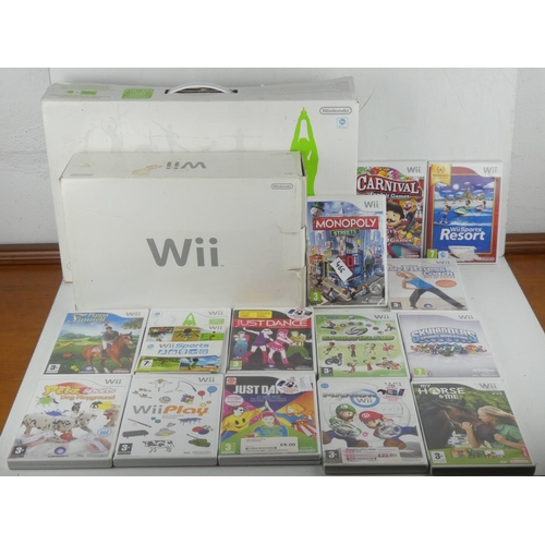 466 - A Nintendo WII console, WII fit board, a large lot of games, controllers etc.