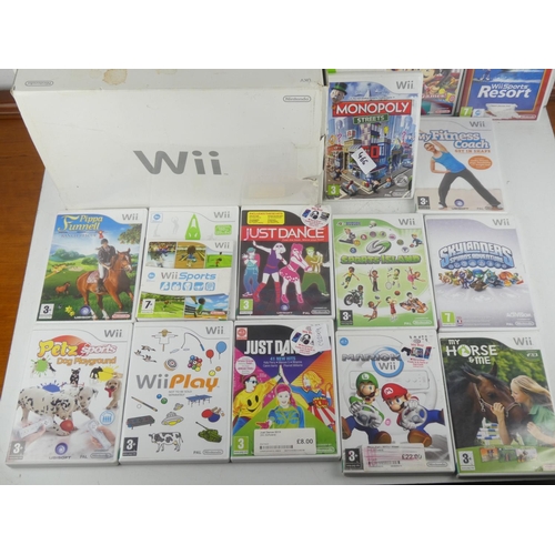 466 - A Nintendo WII console, WII fit board, a large lot of games, controllers etc.