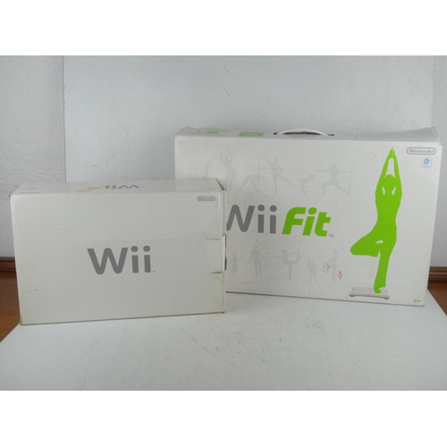 466 - A Nintendo WII console, WII fit board, a large lot of games, controllers etc.