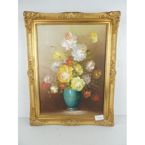 474 - A gilt framed oil painting of flowers signed Robert Cox.