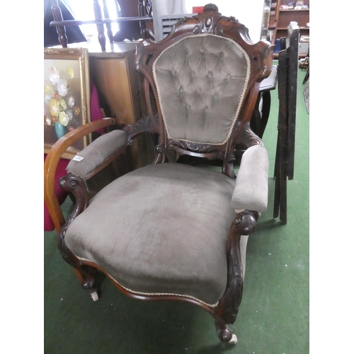 477 - A stunning antique mahogany armchair with carved detail.