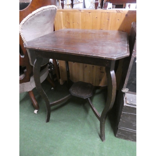 481 - A mahogany table with undershelf.