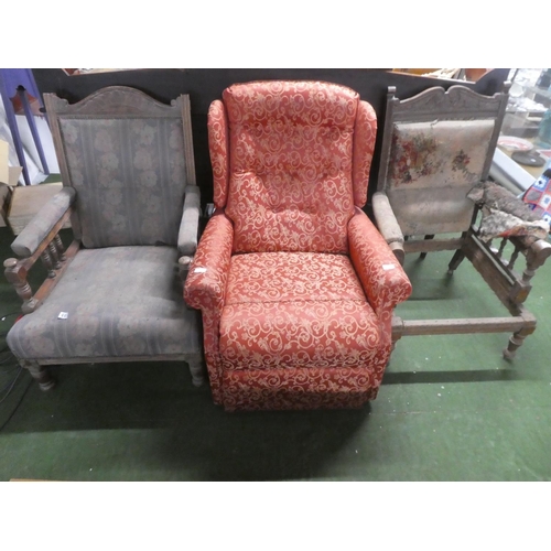 496 - An upholstered reclining armchair and two antique armchairs for restoration.