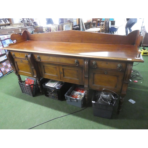 503 - A stunning antique oak sideboard with gallery back and lion mask handles.