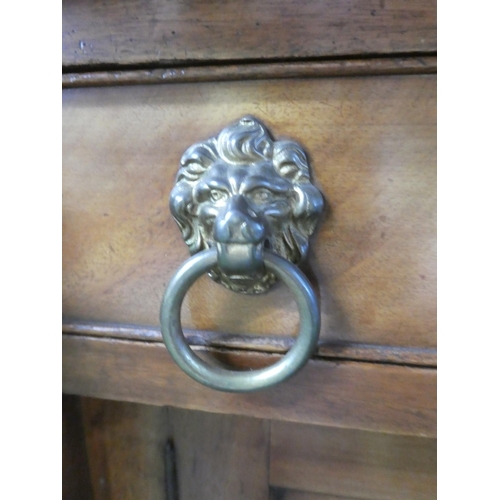 503 - A stunning antique oak sideboard with gallery back and lion mask handles.