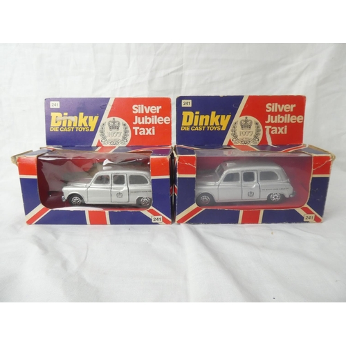 104 - Two vintage boxed Dinky die cast Silver Jubilee taxis.