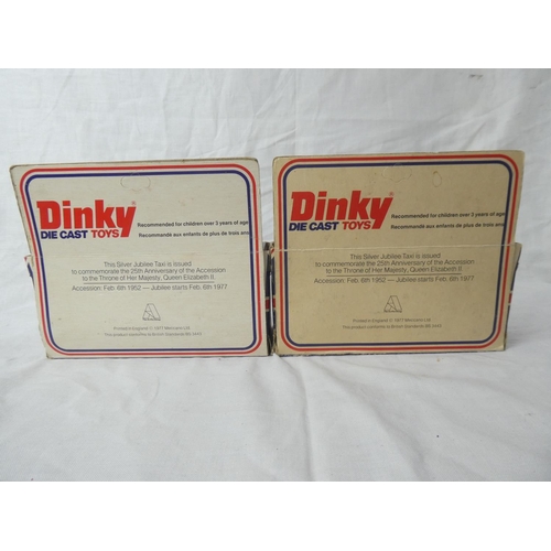 104 - Two vintage boxed Dinky die cast Silver Jubilee taxis.