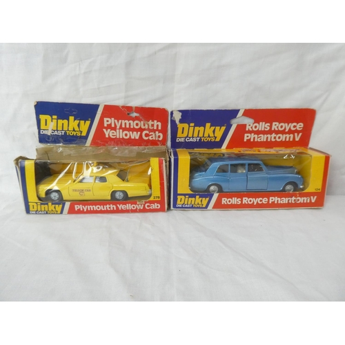 110 - Two vintage boxed Dinky die cast toys - Plymouth Yellow Cab and Rolls Royce Phantom V.