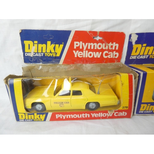 110 - Two vintage boxed Dinky die cast toys - Plymouth Yellow Cab and Rolls Royce Phantom V.