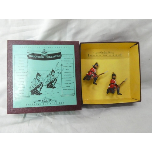 130 - A boxed Britains 8817 'Sherwood Foresters' hand painted - two kneeling on guard figures.