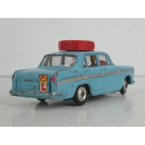 22 - A vintage Corgi Toys Austin A60 'Motor School' diecast car.