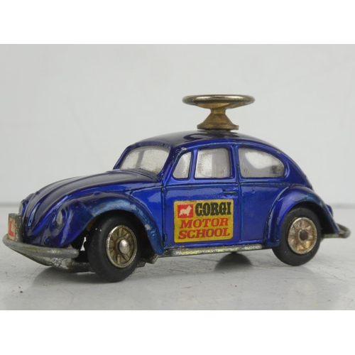 23 - A vintage Corgi Toys Volkswagen 1300 Saloon/ Beetle  'Motor School' diecast car.