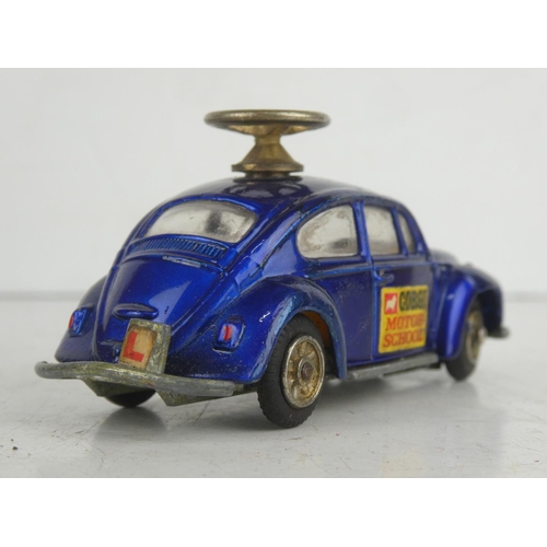 23 - A vintage Corgi Toys Volkswagen 1300 Saloon/ Beetle  'Motor School' diecast car.