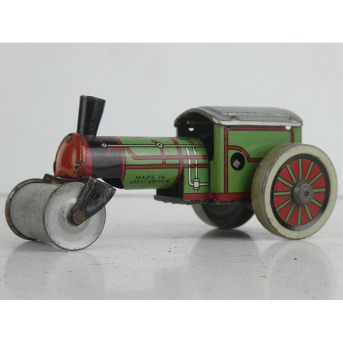 24 - A vintage tinplate Wells Brimtoy clockwork steam roller.