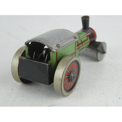 24 - A vintage tinplate Wells Brimtoy clockwork steam roller.