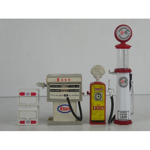 27 - A collection of 4 miniature/ model petrol pumps.