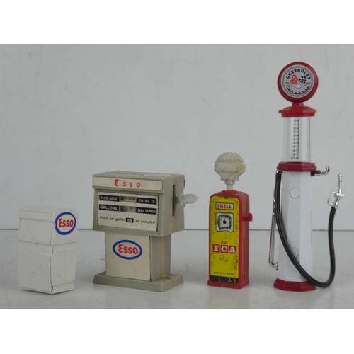 27 - A collection of 4 miniature/ model petrol pumps.