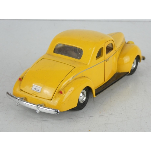 39 - A large diecast model of a Ford Deluxe.