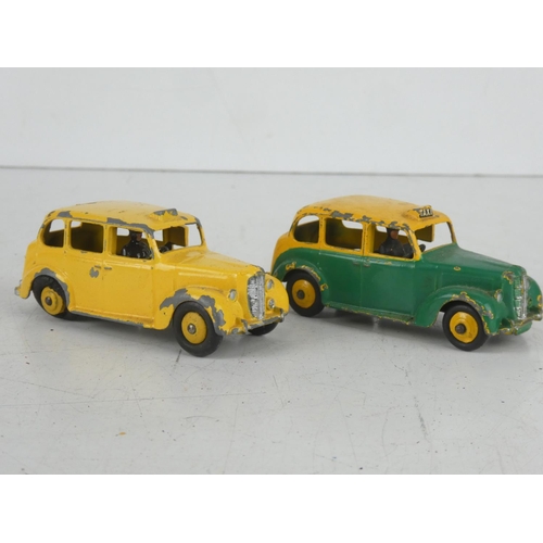 42 - 2 vintage Dinky/ Meccano Ltd Austin Taxi cars.