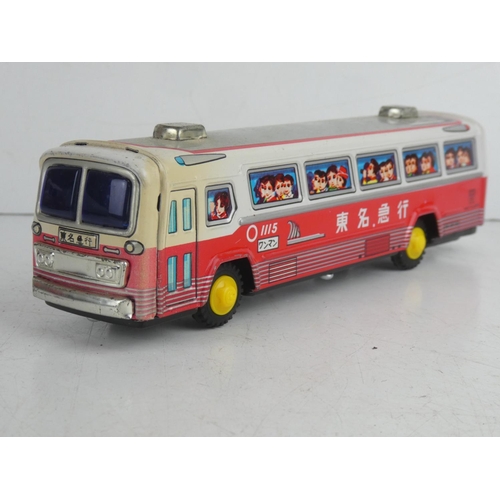 53 - A vintage Japanese friction driven tin plate bus.