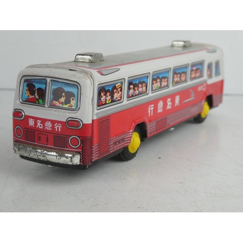 53 - A vintage Japanese friction driven tin plate bus.