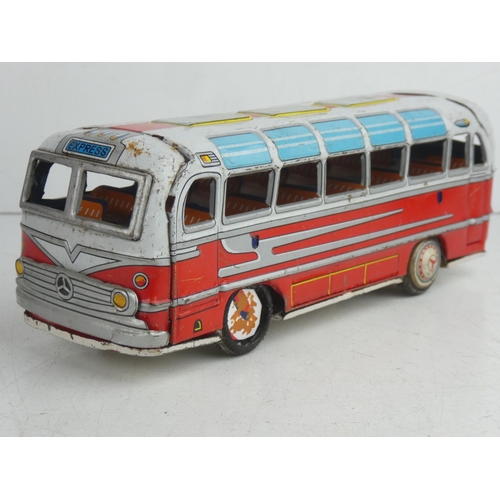 56 - A vintage Japanese friction driven tin plate bus.