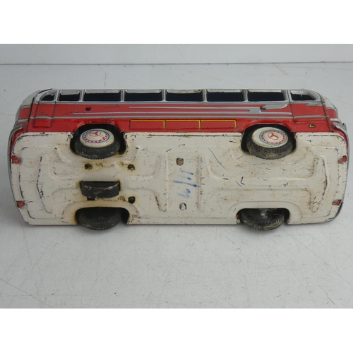 56 - A vintage Japanese friction driven tin plate bus.