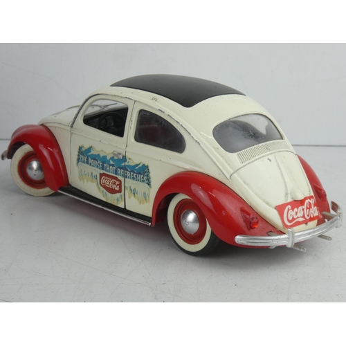 57 - A large diecast Solido VW Beetle, advertising Coca Cola.