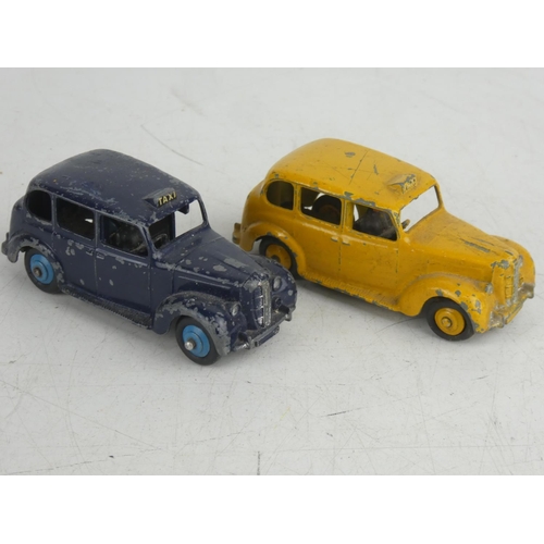 69 - 2 vintage Dinky/ Meccano Ltd Austin Taxi cars.