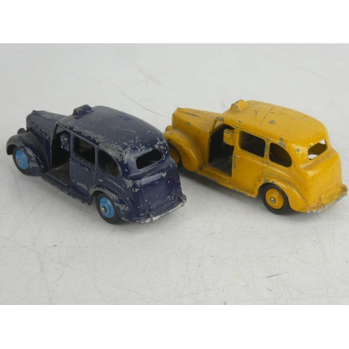 69 - 2 vintage Dinky/ Meccano Ltd Austin Taxi cars.