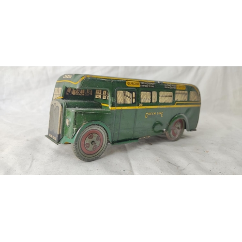 482 - A vintage Wells Brimtoy clockwork tin plate bus - GLX553 - Greenline Transport Bus.