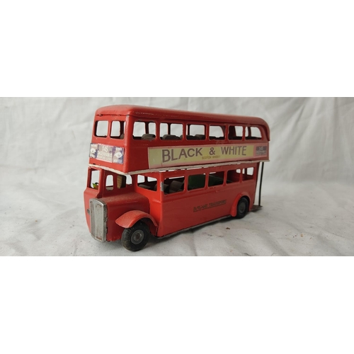 488 - A vintage Tri-Ang Minic Toys tin plate London Transport double decker bus with advertising for Black... 