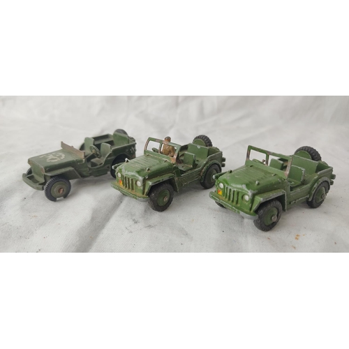 497 - Two vintage Dinky Toys Military Champ vehicles and another jeep.