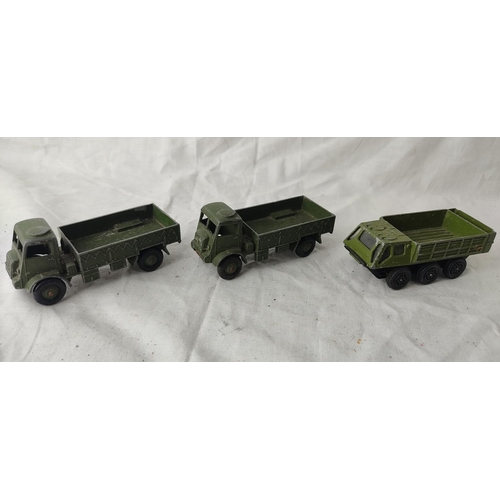 499 - Two vintage Dinky Toys Army Wagons and another Stalwart vehicle.