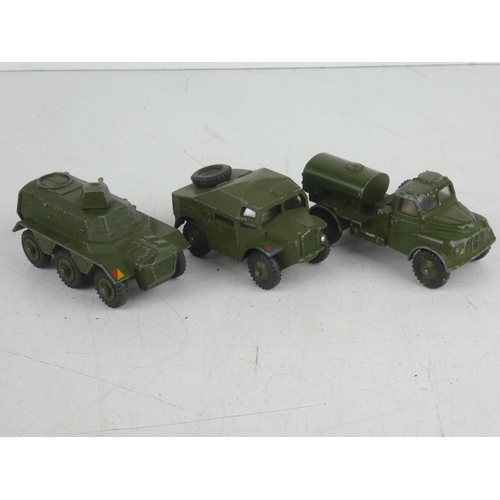 500 - Three vintage Dinky Toys military vehicles - Field Artillery Tractor, Armoured Personnel Carrier and... 