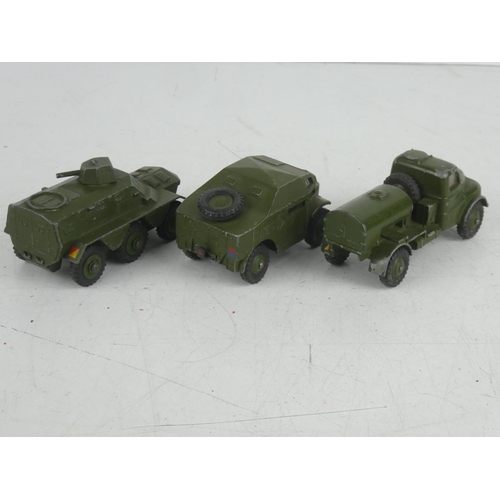 500 - Three vintage Dinky Toys military vehicles - Field Artillery Tractor, Armoured Personnel Carrier and... 