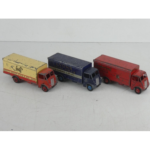 512 - Three vintage Dinky Toys 'Guy' lorries - Spratts, Lyons Swiss Rolls, and Sumberland.